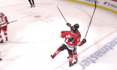 Chicago Blackhawks forwards Taylor Hall #71 and Nick Foligno #17 celebrate after Foligno scores to tie the Blackhawks and Red Wings at 1.